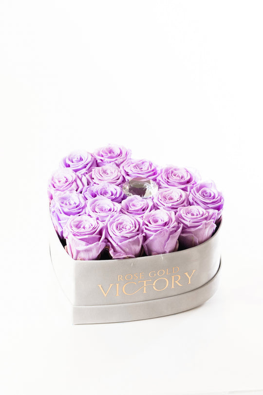 Lilac preserved roses in a grey suede heart box with a crystal center, Rose Gold Victory