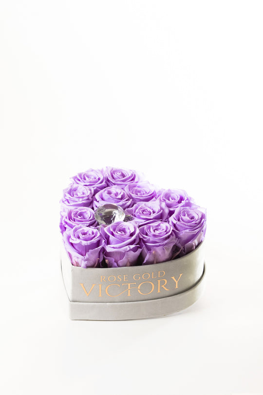 Lilac preserved roses in a grey suede heart box with a crystal center, Rose Gold Victory