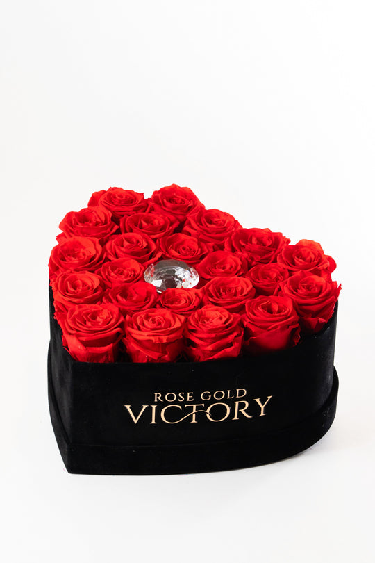 Red preserved roses in a black velvet heart box with a crystal center, Rose Gold Victory