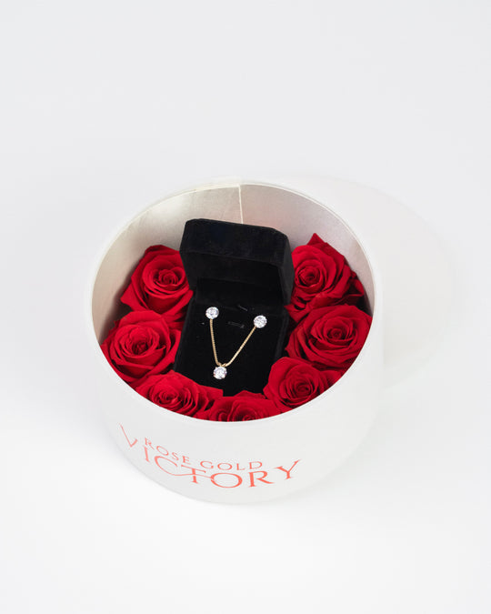 Red preserved roses with a gold jewelry set in a white round box — Rose Gold Victory